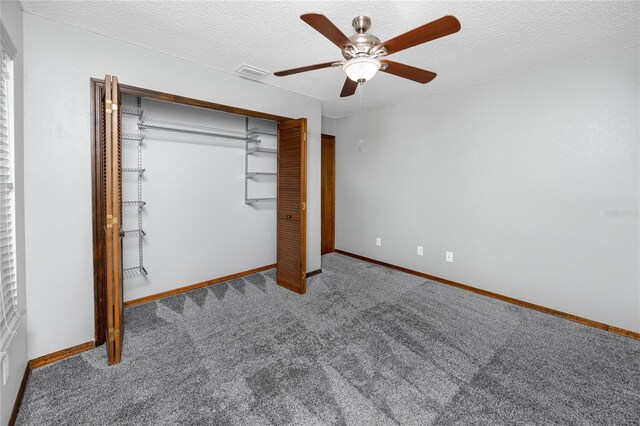 11203 Egret Nest Ct, Riverview, FL 33569 - unfurnished bedroom featuring carpet, a closet, a ceiling fan, and a textured ceiling