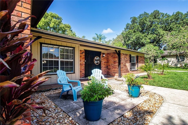 4205 Helene Pl, Valrico, FL 33594 - view of front of home with brick siding and a porch