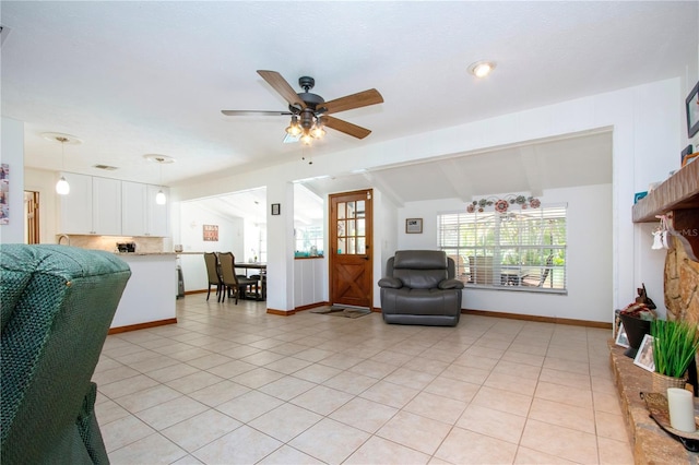 4205 Helene Pl, Valrico, FL 33594 - living room with vaulted ceiling, ceiling fan, and light tile patterned flooring
