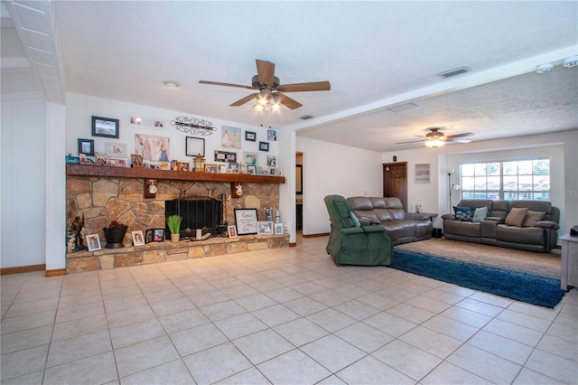 4205 Helene Pl, Valrico, FL 33594 - living area featuring ceiling fan, light tile patterned floors, and a stone fireplace