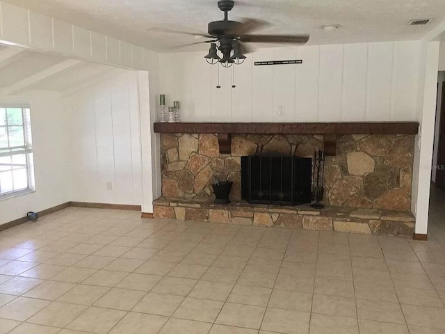 4205 Helene Pl, Valrico, FL 33594 - unfurnished living room with a ceiling fan, a stone fireplace, and light tile patterned floors