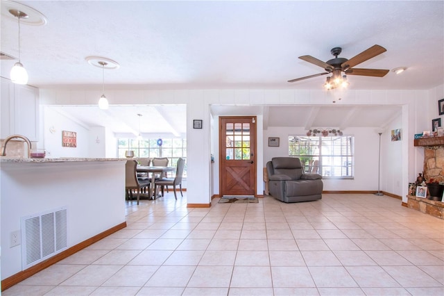 4205 Helene Pl, Valrico, FL 33594 - entrance foyer featuring vaulted ceiling, healthy amount of natural light, light tile patterned floors, and a ceiling fan