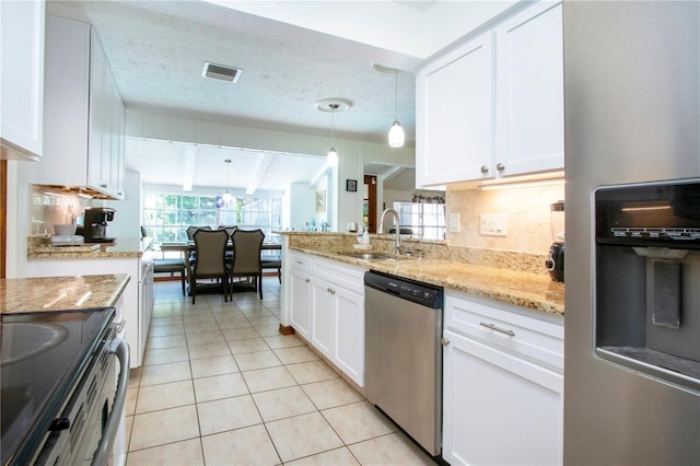 4205 Helene Pl, Valrico, FL 33594 - kitchen with appliances with stainless steel finishes, white cabinetry, light tile patterned floors, light stone counters, and pendant lighting