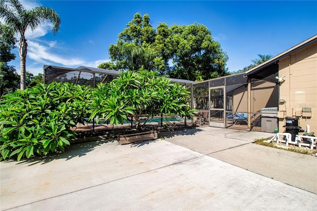 4205 Helene Pl, Valrico, FL 33594 - view of patio featuring a lanai and an outdoor pool