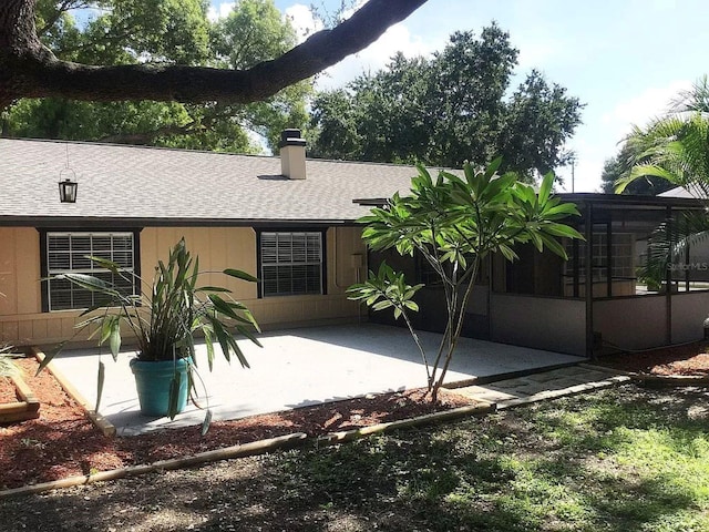 4205 Helene Pl, Valrico, FL 33594 - back of house with a patio, roof with shingles, and a chimney
