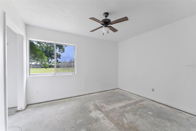 1041 SE Spinnaker Ave, Saint Lucie West, FL 34983 - spare room with a ceiling fan and concrete flooring
