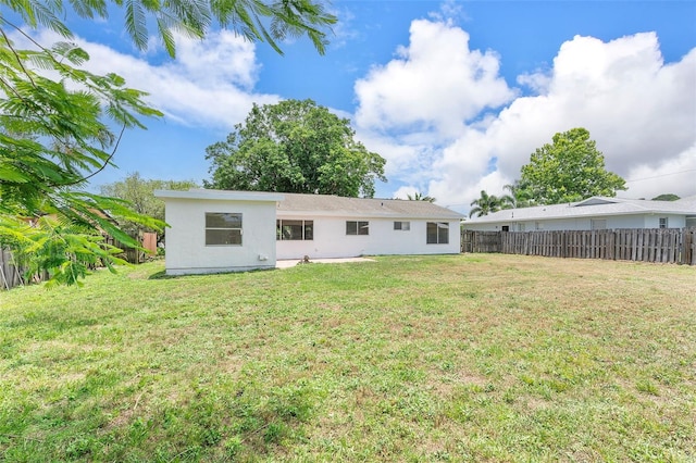 1041 SE Spinnaker Ave, Saint Lucie West, FL 34983 - back of property featuring stucco siding