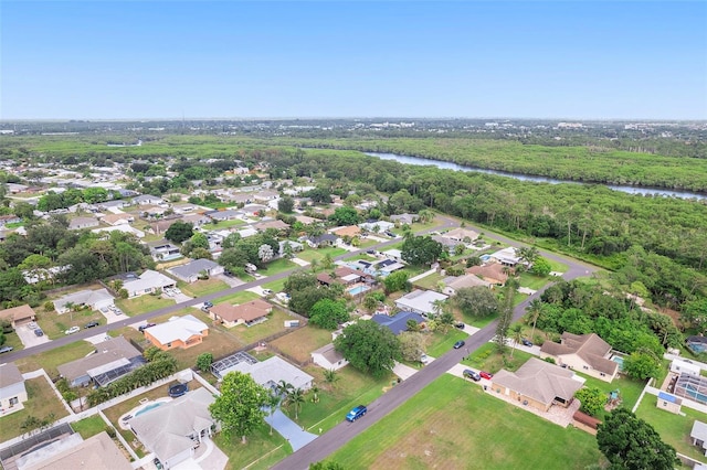 1041 SE Spinnaker Ave, Saint Lucie West, FL 34983 - aerial overview of property's location with a nearby body of water and nearby suburban area