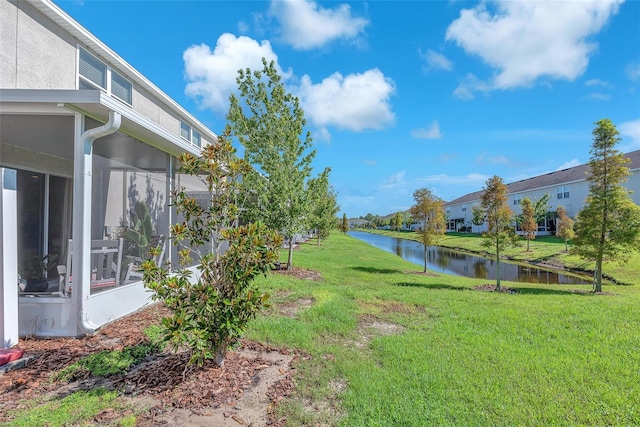 7124 Summer Holly Pl, Riverview, FL 33578 - view of grassy yard featuring a water view and a sunroom
