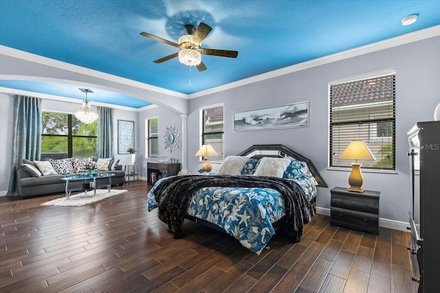 8358 Dunham Station Dr, Tampa, FL 33647 - bedroom with arched walkways, dark wood-type flooring, crown molding, a ceiling fan, and a chandelier