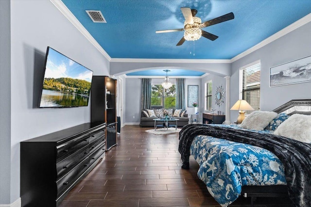 8358 Dunham Station Dr, Tampa, FL 33647 - bedroom featuring arched walkways, crown molding, ornate columns, a textured ceiling, and dark wood-style flooring