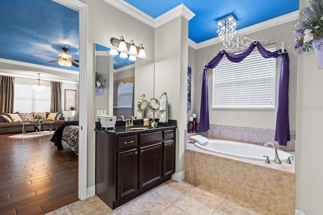 8358 Dunham Station Dr, Tampa, FL 33647 - full bath featuring crown molding, a chandelier, a bath, vanity, and ensuite bath
