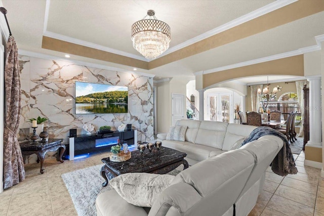 8358 Dunham Station Dr, Tampa, FL 33647 - living area featuring a chandelier, a raised ceiling, tile patterned floors, ornate columns, and crown molding