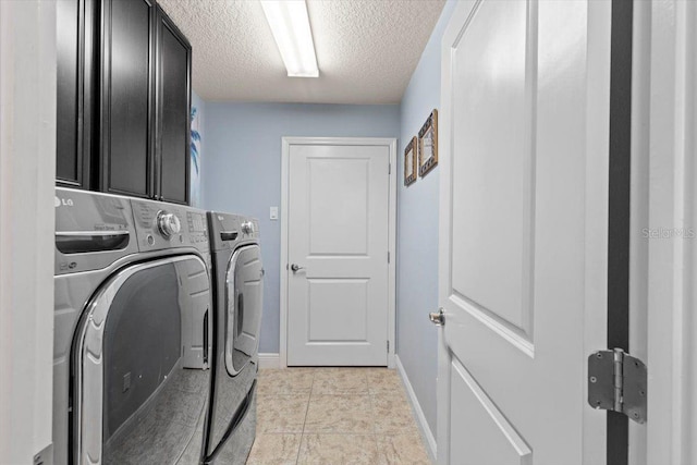 8358 Dunham Station Dr, Tampa, FL 33647 - laundry room with washer and clothes dryer, cabinet space, and a textured ceiling