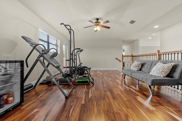 8358 Dunham Station Dr, Tampa, FL 33647 - workout room with wood finished floors, ceiling fan, and recessed lighting