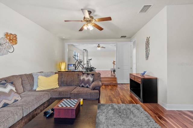 8358 Dunham Station Dr, Tampa, FL 33647 - living area with wood finished floors and ceiling fan