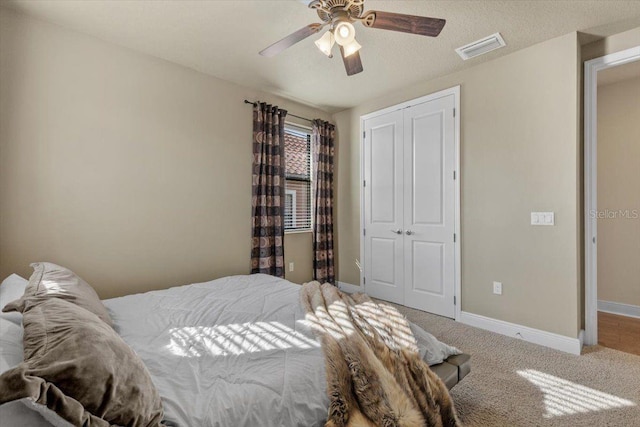 8358 Dunham Station Dr, Tampa, FL 33647 - carpeted bedroom with a closet and ceiling fan