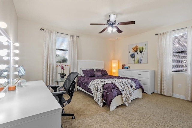 8358 Dunham Station Dr, Tampa, FL 33647 - bedroom featuring light colored carpet, a ceiling fan, and a desk