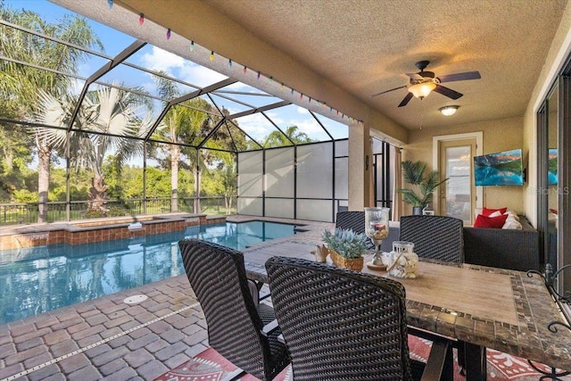8358 Dunham Station Dr, Tampa, FL 33647 - view of patio featuring ceiling fan, an outdoor pool, outdoor dining area, and a lanai