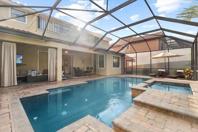 8358 Dunham Station Dr, Tampa, FL 33647 - view of pool with a patio area, glass enclosure, a pool with connected hot tub, and outdoor dining space