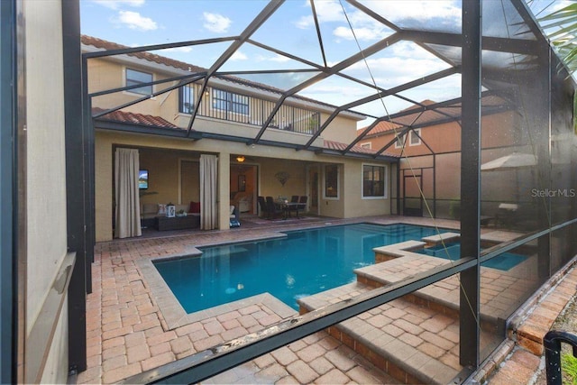 8358 Dunham Station Dr, Tampa, FL 33647 - view of pool with a patio, glass enclosure, and a pool with connected hot tub