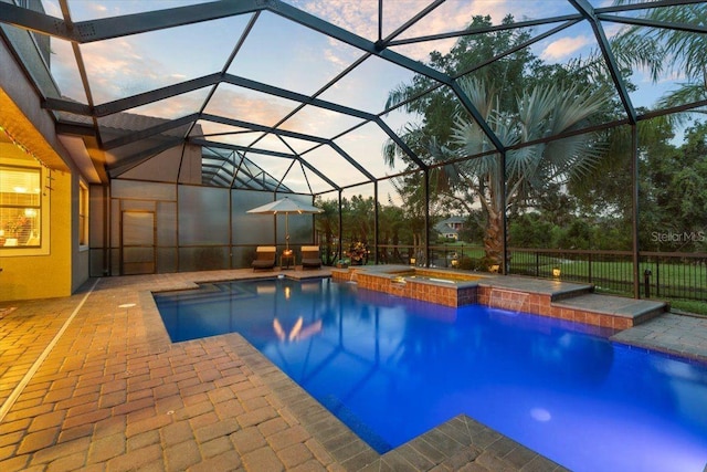 8358 Dunham Station Dr, Tampa, FL 33647 - view of swimming pool featuring a patio, a pool with connected hot tub, and a lanai