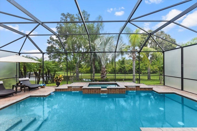 8358 Dunham Station Dr, Tampa, FL 33647 - view of swimming pool with glass enclosure, a pool with connected hot tub, a patio area, and view of wooded area