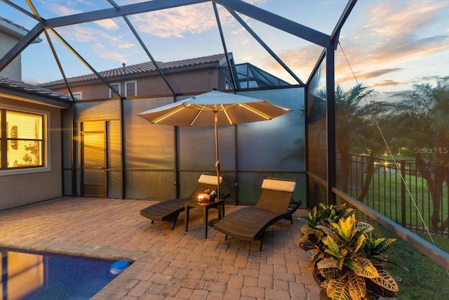 8358 Dunham Station Dr, Tampa, FL 33647 - patio terrace at dusk with a patio and a lanai