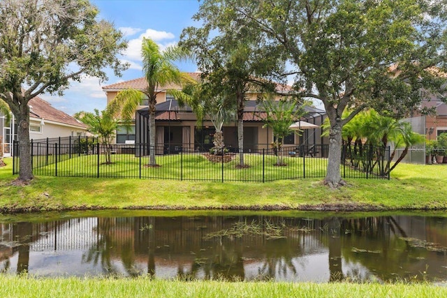 8358 Dunham Station Dr, Tampa, FL 33647 - rear view of house featuring stucco siding, a water view, and a tile roof