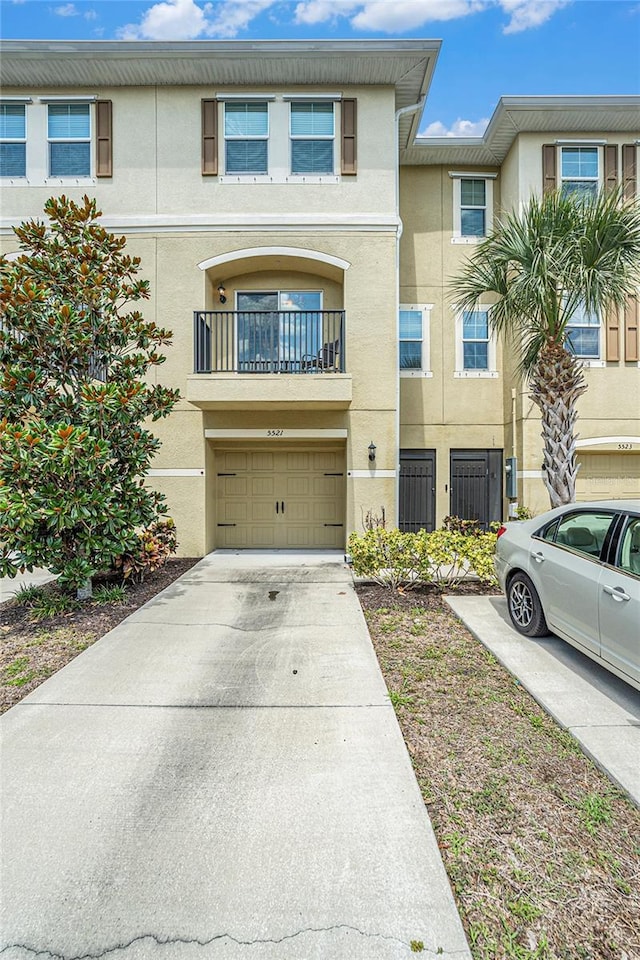 5521 Yellowfin Ct, New Port Richey, FL 34652 - view of property with stucco siding, concrete driveway, and an attached garage