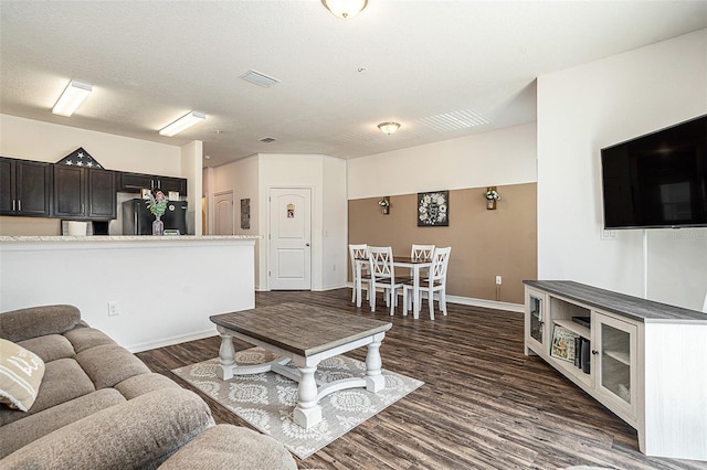 5521 Yellowfin Ct, New Port Richey, FL 34652 - living area featuring dark wood-style flooring and baseboards