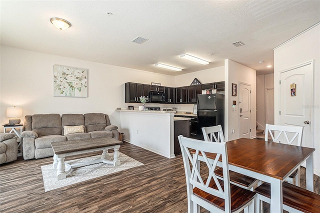 5521 Yellowfin Ct, New Port Richey, FL 34652 - living area featuring dark wood finished floors and baseboards