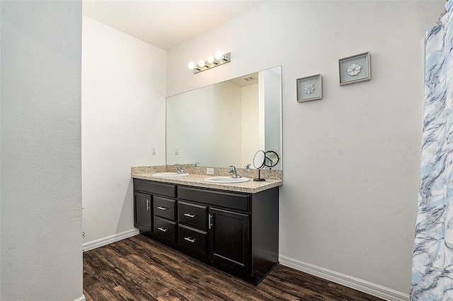 5521 Yellowfin Ct, New Port Richey, FL 34652 - bathroom with wood finished floors and double vanity