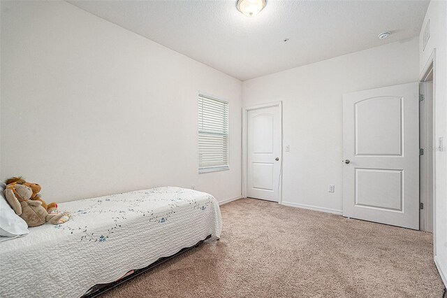 5521 Yellowfin Ct, New Port Richey, FL 34652 - bedroom featuring carpet and baseboards
