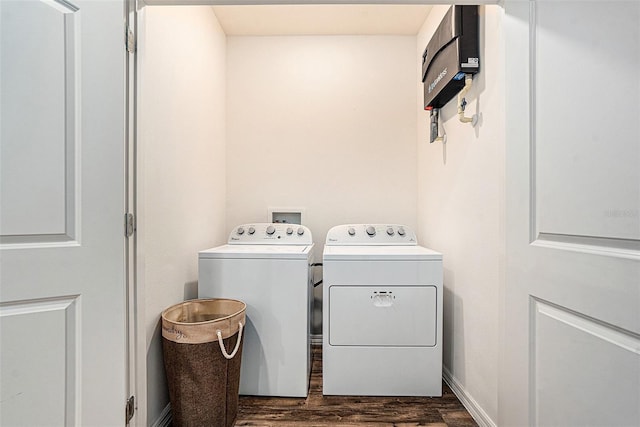 5521 Yellowfin Ct, New Port Richey, FL 34652 - laundry area with washing machine and clothes dryer and dark wood finished floors