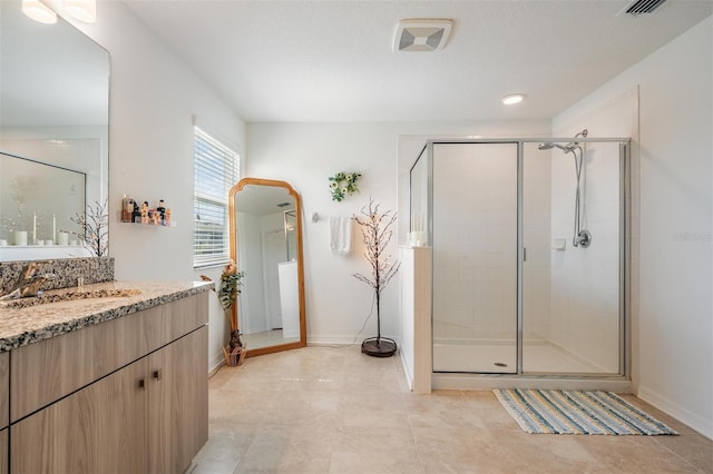 7517 Notched Pine Bnd, Wesley Chapel, FL 33545 - full bath featuring vanity, a shower stall, tile patterned floors, and recessed lighting