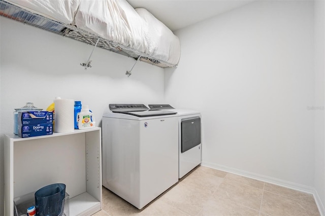 7517 Notched Pine Bnd, Wesley Chapel, FL 33545 - washroom featuring washing machine and dryer and baseboards