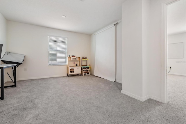 7517 Notched Pine Bnd, Wesley Chapel, FL 33545 - recreation room featuring carpet and baseboards