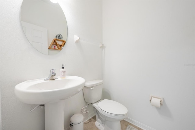 7517 Notched Pine Bnd, Wesley Chapel, FL 33545 - bathroom featuring toilet and baseboards