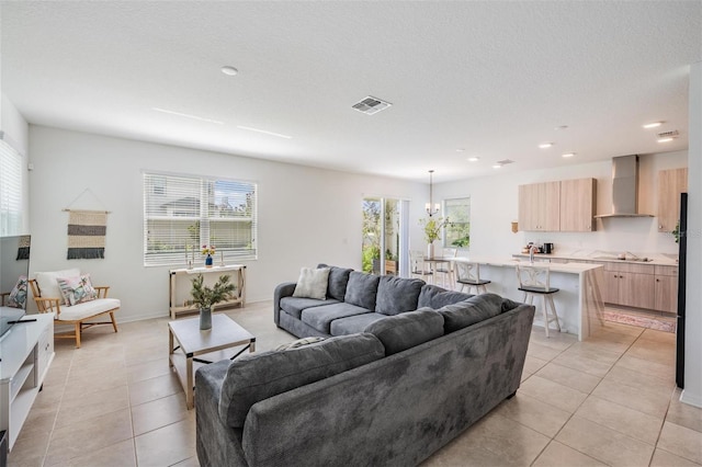 7517 Notched Pine Bnd, Wesley Chapel, FL 33545 - living area with light tile patterned floors and recessed lighting