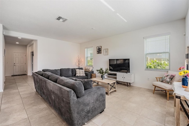 7517 Notched Pine Bnd, Wesley Chapel, FL 33545 - living area with light tile patterned flooring and baseboards