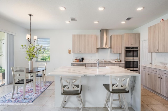 7517 Notched Pine Bnd, Wesley Chapel, FL 33545 - kitchen featuring wall chimney exhaust hood, light brown cabinetry, stainless steel double oven, modern cabinets, and recessed lighting