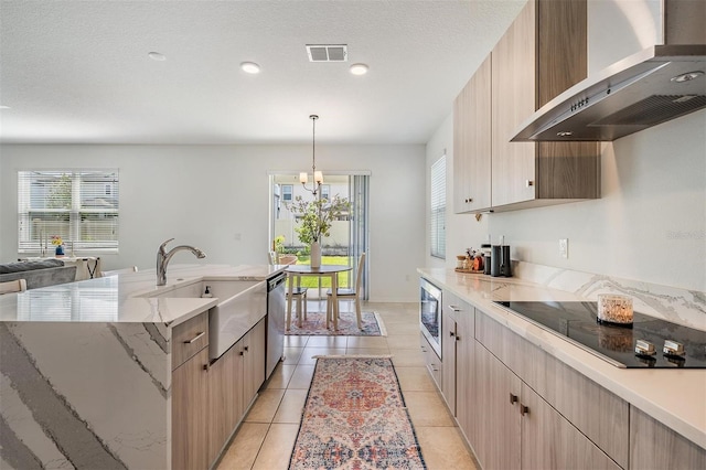 7517 Notched Pine Bnd, Wesley Chapel, FL 33545 - kitchen featuring wall chimney exhaust hood, stainless steel appliances, light brown cabinetry, an island with sink, and healthy amount of natural light