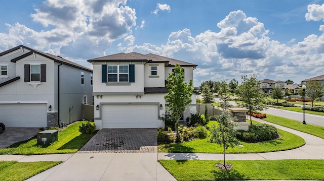 7517 Notched Pine Bnd, Wesley Chapel, FL 33545 - traditional-style home with decorative driveway, stucco siding, an attached garage, and a residential view
