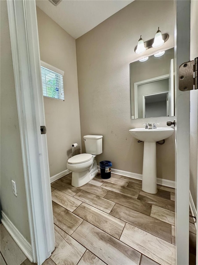2612 E 26th Ave, Tampa, FL 33605 - half bath with toilet and wood finish floors