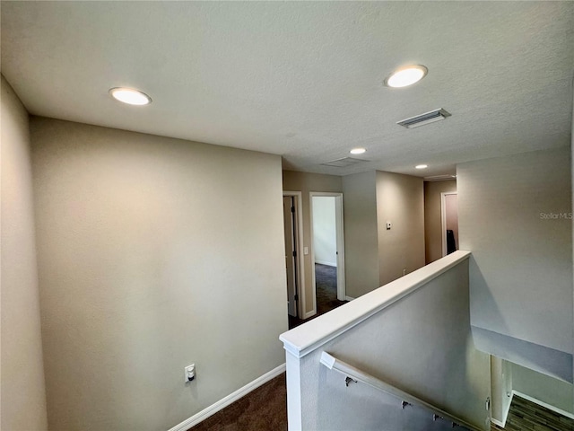 2612 E 26th Ave, Tampa, FL 33605 - hall featuring dark carpet, an upstairs landing, and recessed lighting