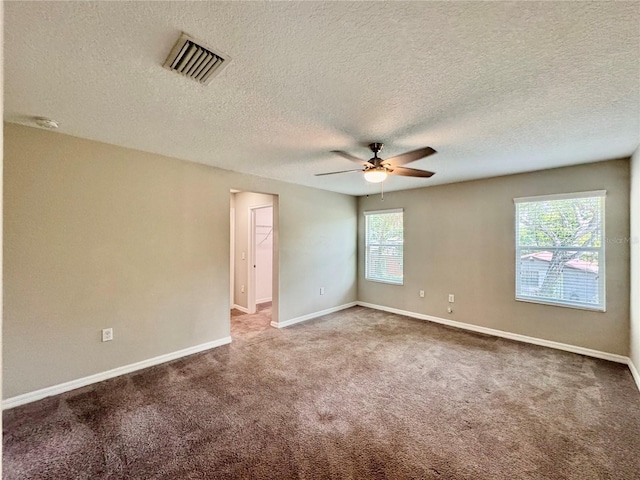 2612 E 26th Ave, Tampa, FL 33605 - carpeted spare room featuring a ceiling fan, healthy amount of natural light, a textured ceiling, and a smoke detector