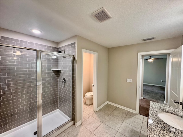 2612 E 26th Ave, Tampa, FL 33605 - full bathroom featuring a stall shower, tile patterned floors, a textured ceiling, and vanity