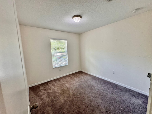 2612 E 26th Ave, Tampa, FL 33605 - carpeted empty room featuring a textured ceiling and a smoke detector
