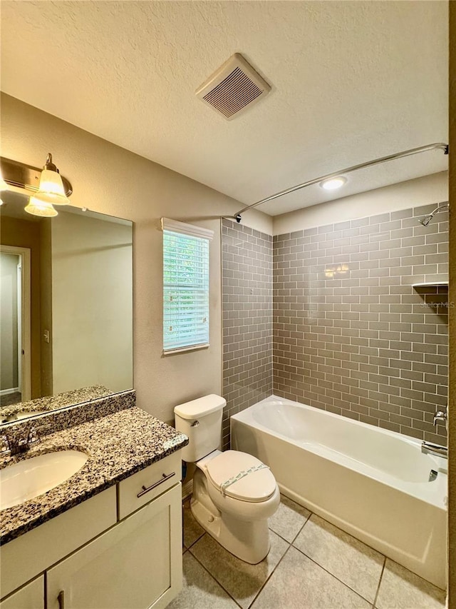 2612 E 26th Ave, Tampa, FL 33605 - full bath with tile patterned flooring, vanity, shower / bath combination, and a textured ceiling